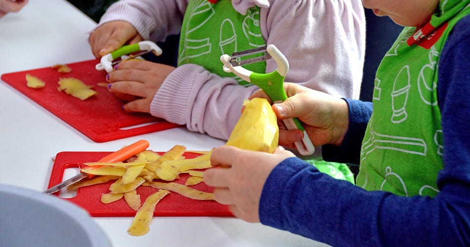 kids peeling potato
