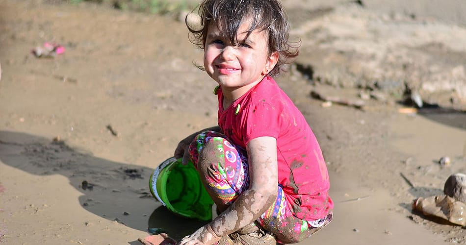 child on the mud